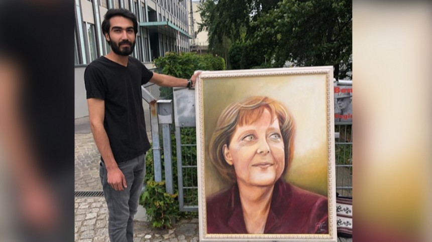 Видео: пытавшегося подарить Меркель портрет мужчину полиция приняла за пикетчика